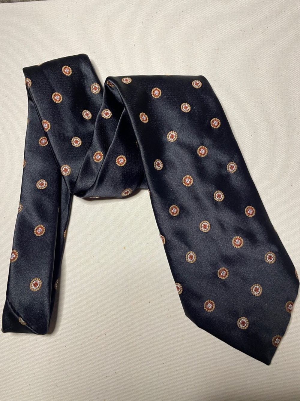 CHRISTIAN DIOR Black Luxury Tie with Small Gold & Red Medallion Motif Pattern